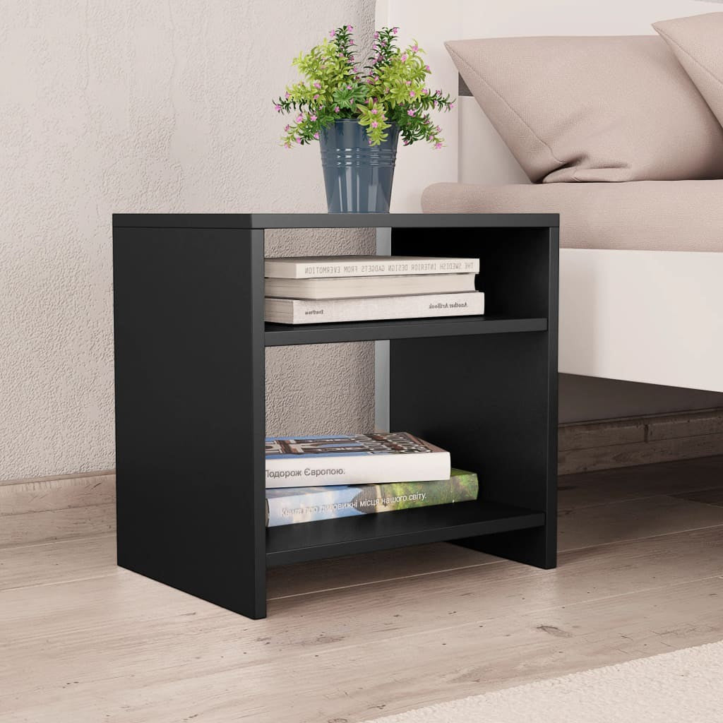 Modern Home black bedside table with two open shelves holding books and a potted plant next to a bed