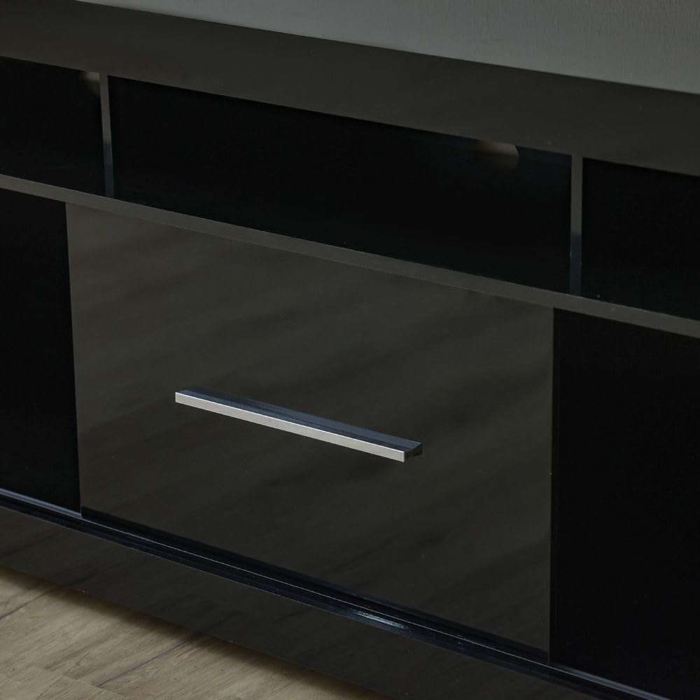 Modern Home black media console with open shelving and a central cabinet featuring a sleek silver handle
