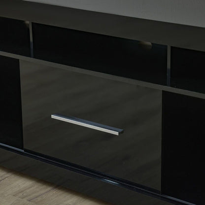 Modern Home black media console with open shelving and a central cabinet featuring a sleek silver handle
