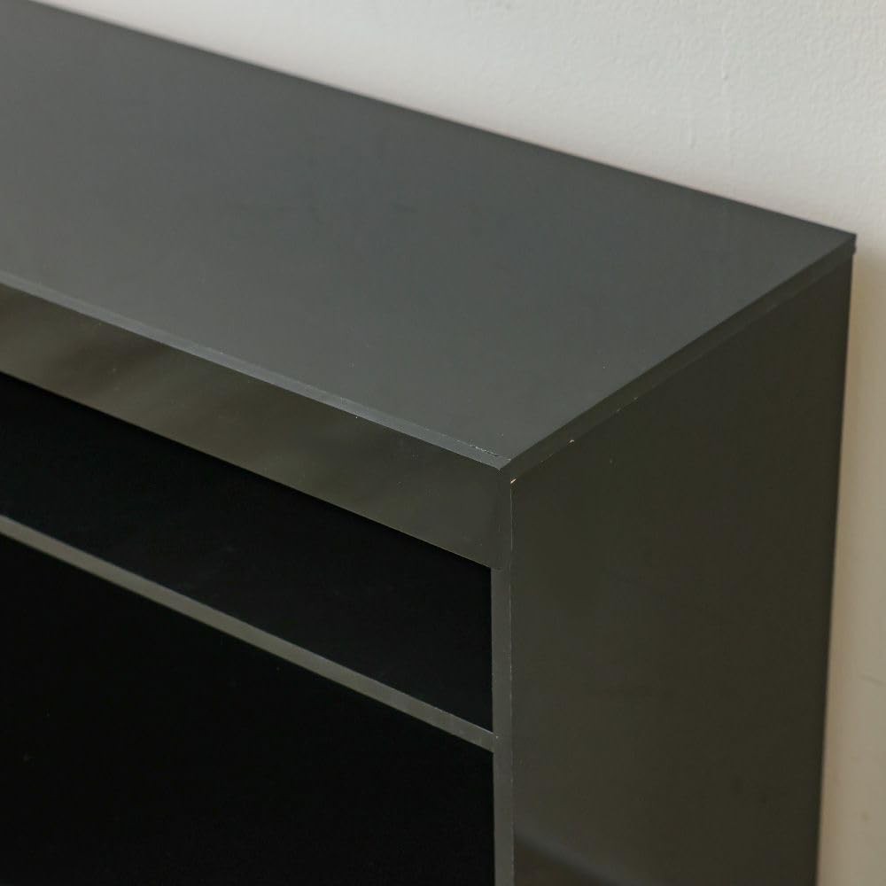 Modern Home black media console featuring a minimalist design with open shelving for entertainment storage.