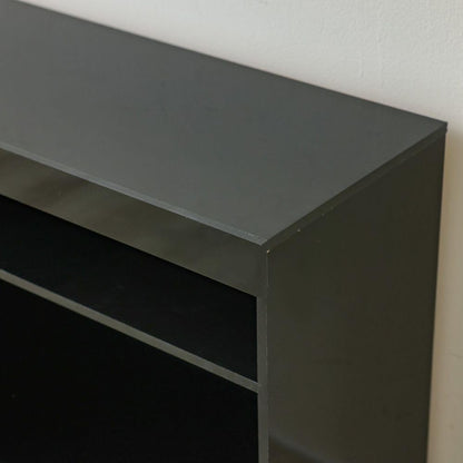 Modern Home black media console featuring a minimalist design with open shelving for entertainment storage.