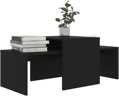 Modern Home black nesting coffee table set with minimalist geometric design and a small potted plant on top.