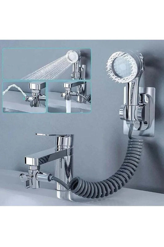 Modern Home chrome bathroom sink faucet attachment with handheld sprayer, coiled hose, and wall-mount bracket.