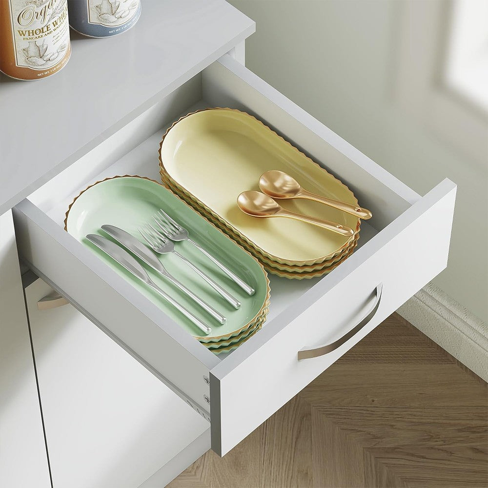 Modern Home kitchen pantry cabinet drawer open with stacked pastel plates, silverware, and gold spoons