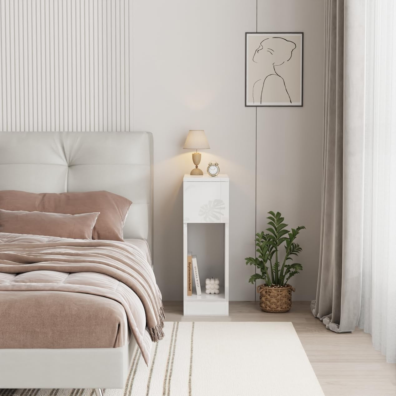 Modern Home narrow white bedside table with a drawer and open shelf in a minimalist bedroom setting.