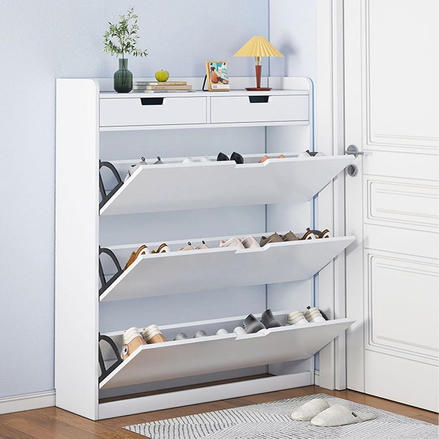 Modern Home white slim entryway shoe cabinet with three tipping storage compartments and two top drawers for organization.