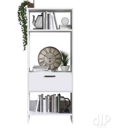 Modern Home tall white bookshelf with open shelving and a central storage drawer, styled with books and decor.