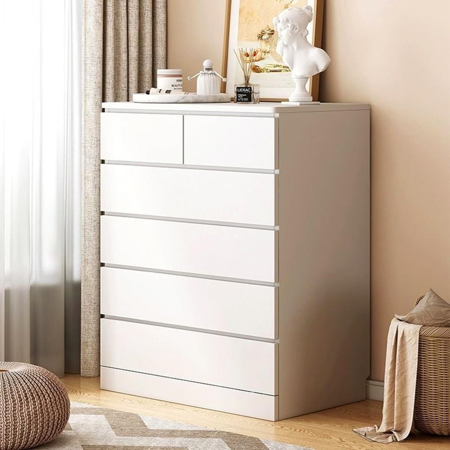 Modern Home white 5-drawer dresser with a minimalist design, featuring a flat top for decor in a bright bedroom.