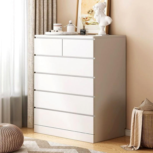 Modern Home white 5-drawer dresser with a minimalist design, featuring a flat top for decor in a bright bedroom.