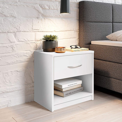 Modern Home white bedside table with a drawer and open shelf, featuring an aluminum handle next to a grey bed.