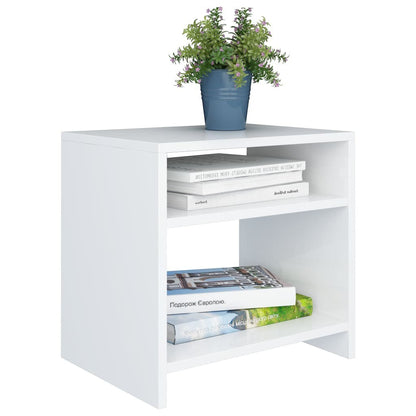 Modern Home white bedside table with two open shelves, styled with books and a small potted plant.