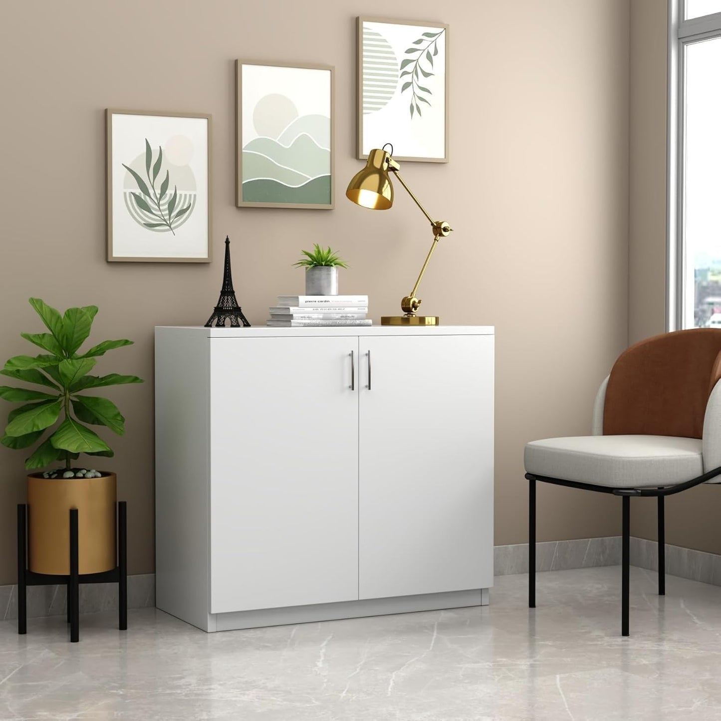 Modern Home white two-door storage cabinet with interior shelf in a minimalist living room setting.