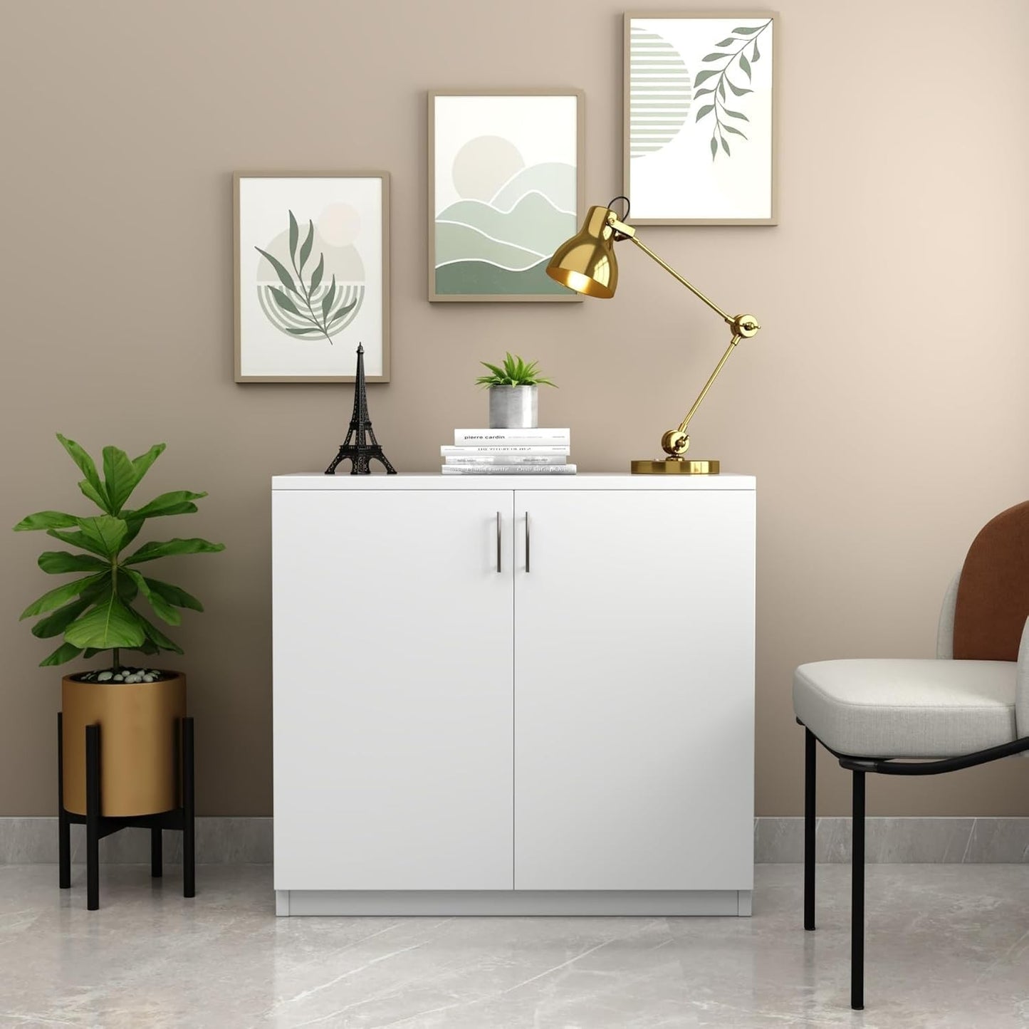 Modern Home white two-door storage cabinet with interior shelf in a minimalist living room setting.