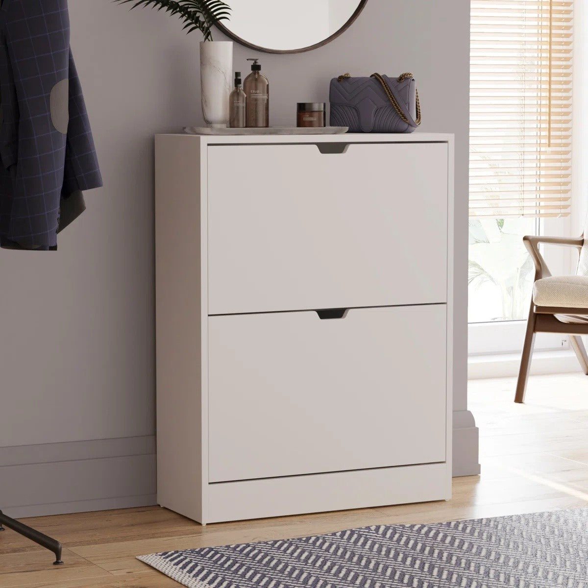 Modern Home white two-tier shoe storage cabinet with drop-down compartments in a minimalist entryway setting.