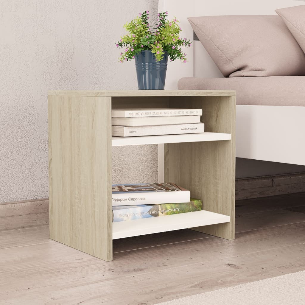 Modern Home white and light wood bedside table with two open shelves for storage next to a bed